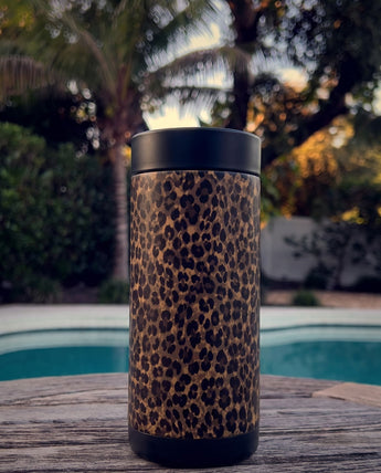 Chocolate Leopard wrap on a black ceramic Wrapware Tumbler poolside