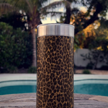 Chocolate Leopard wrap on a stainless Wrapware Tumbler on a poolside table