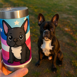 Hand holding a custom tumbler with a cartoon portrait of the French bulldog sitting behind it