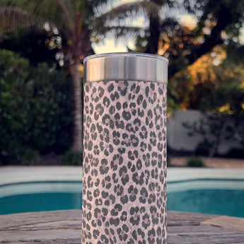 Purrpink Leopard wrap on a stainless Wrapware Tumbler on a poolside table