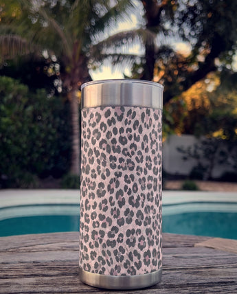 Purrpink Leopard wrap on a stainless Wrapware Tumbler on a poolside table