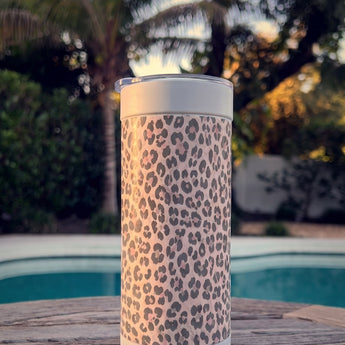 Purrpink Leopard wrap on a white ceramic Wrapware Tumbler poolside