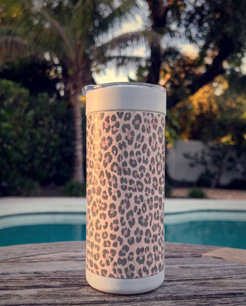 Purrpink Leopard wrap on a white ceramic Wrapware Tumbler poolside