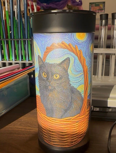 Chelsea's black ceramic tumbler on her art desk — 5-star review photo