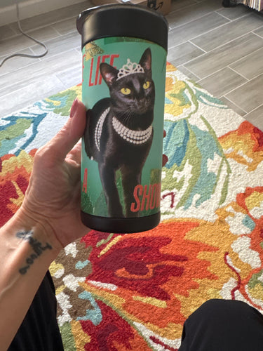 Rachel holding her tumbler at home — 5-star review photo
