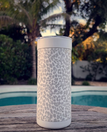 Snow Leopard wrap on a white ceramic Wrapware Tumbler poolside