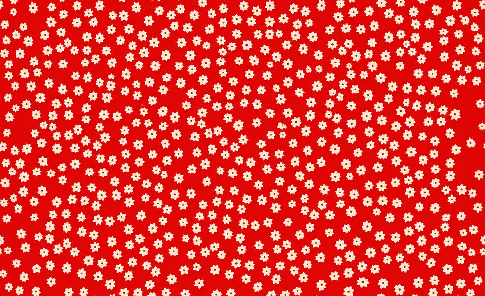 The finished flat pattern: tiny cream flowers scattered on red.